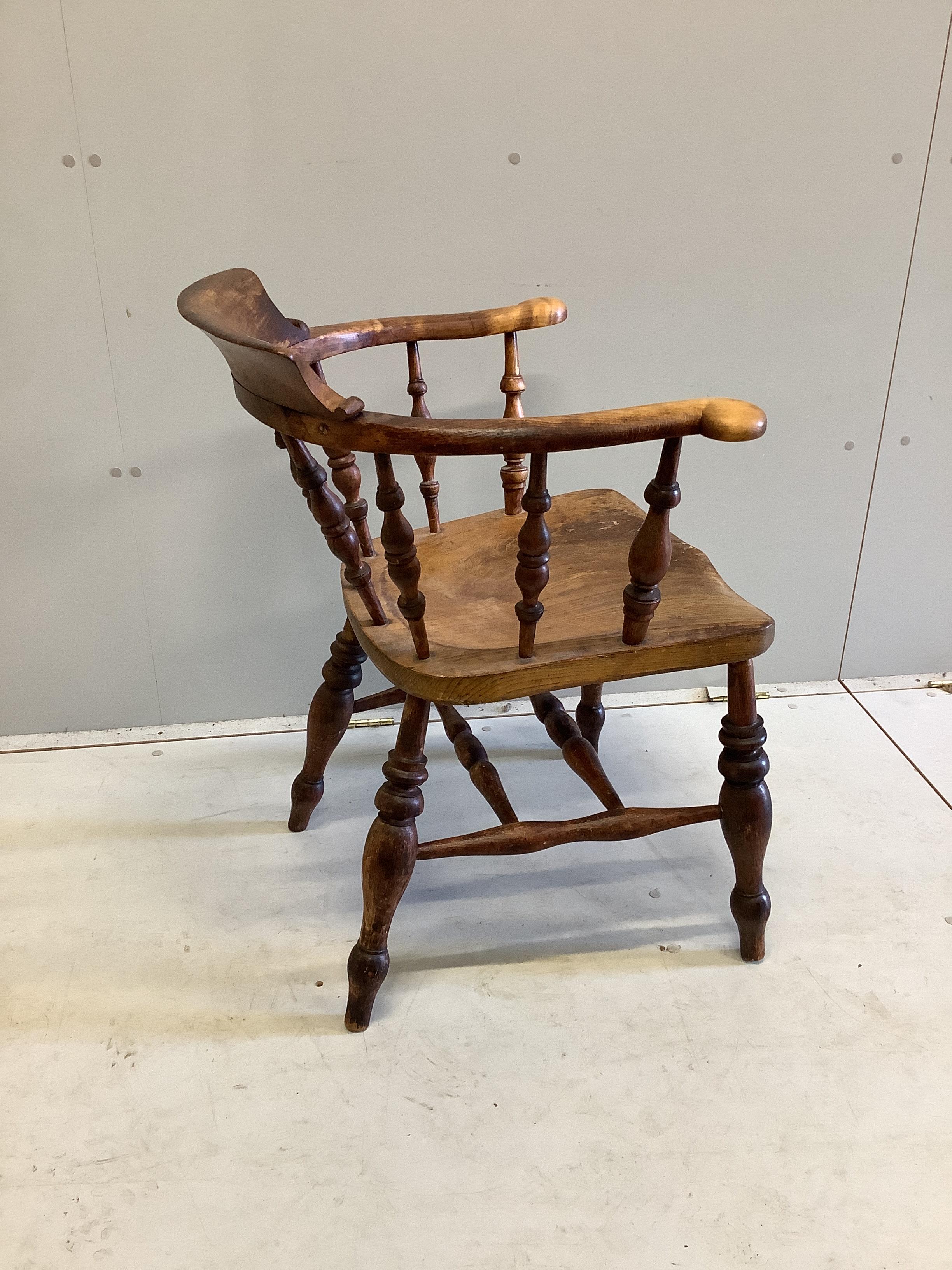 A Victorian elm and beech Windsor smoker's bow elbow chair, width 59cm, depth 47cm, height 80cm